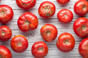 organic farm tomatoes on wooden background  top view