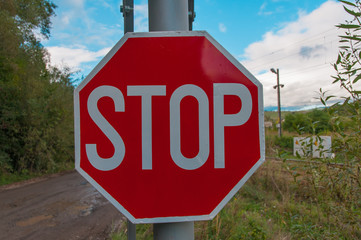 Stop sign at the railroad.