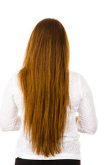 Woman standing backwards showing her long hair