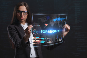 The concept of business, technology, the Internet and the network. A young entrepreneur working on a virtual screen of the future and sees the inscription: Foresight