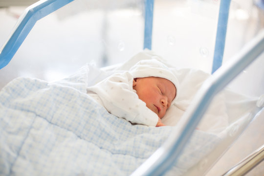 Newborn Baby Laying In Crib In Prenatal Hospital