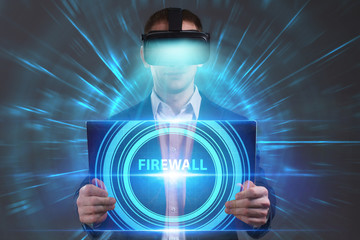 Business, Technology, Internet and network concept. Young businessman working in virtual reality glasses sees the inscription: Firewall
