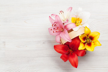 Colorful lily flowers basket