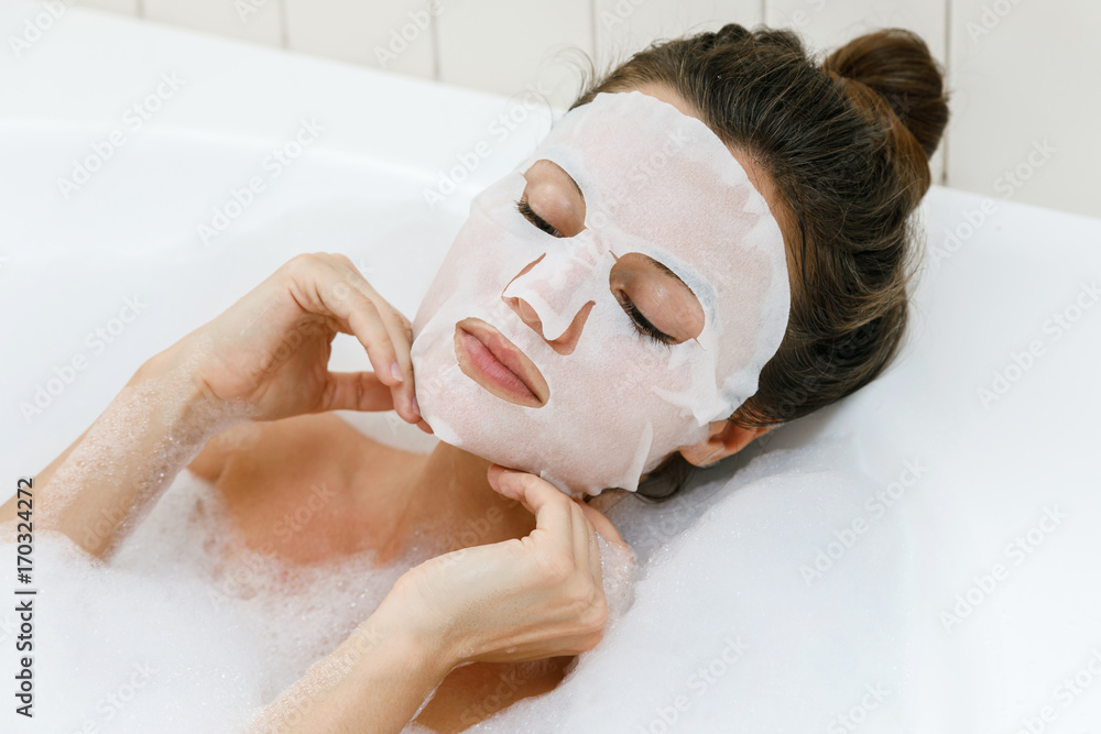 Poster Woman with sheet mask on her face