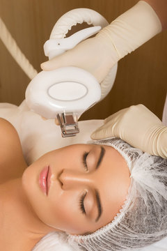 Beautiful woman in beauty salon during rejuvenation procedure
