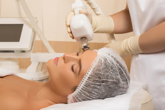 Beautiful woman in beauty salon during rejuvenation procedure