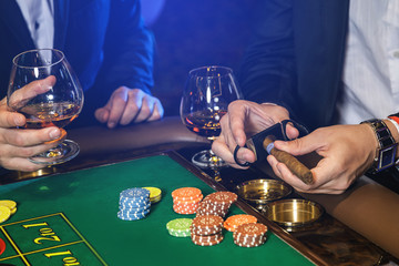 Man is cutting cigar