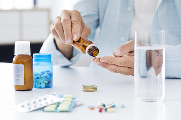 Old man taking pills