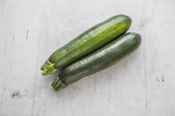 Zucchini. Fresh zucchini on white concrete board