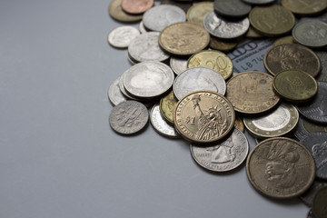 Many coins of different countries in one image.