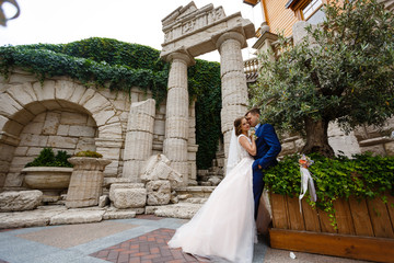 Happy bride and groom in a castle on their wedding day