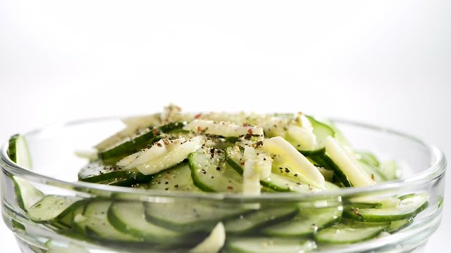The cucumbers cut by thin slices with garlic in ware from glass sprinkle ground pepper and pour with olive oil