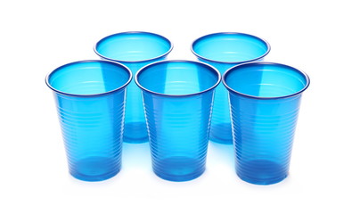 Blue, plastic cups isolated on white background