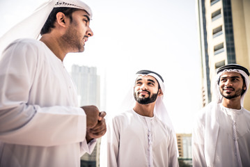 Three arabic business men spending time in Dubai