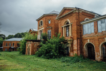 Abandoned and overgrown former Nechaev's mansion in Polibino village 