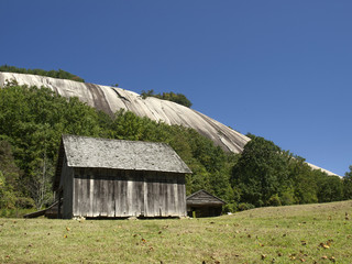 Stone Mountain and barn on a clear day 