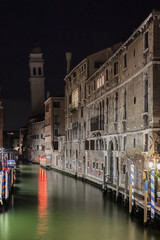 A night glimpse of the Rio dei Greci Canal and in the background the typical Venetian Bell Tower