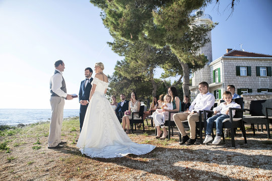 Bride and groom at  wedding ceremony on beach