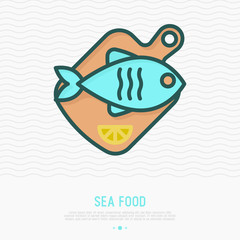 Fish on wooden cutting board with lemon thin line icon. Element for logo of fish restaurant or healthy seafood. Simple vector illustration.
