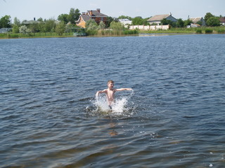 children bathe in the river