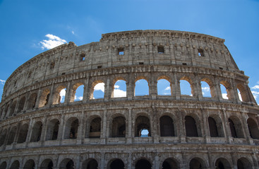 Fototapeta na wymiar View of Colosseum in Rome with blue sky Italy, Europe.