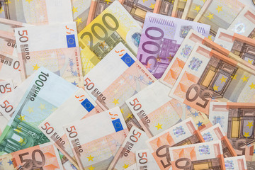 euro banknotes as background. 50 100 200 500