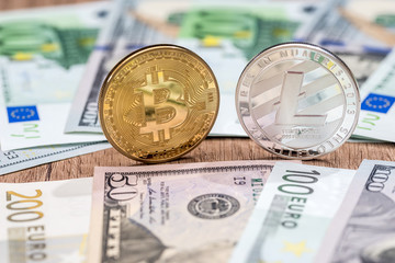Litecoin and bitcoin with dollar and euro bills. business concept