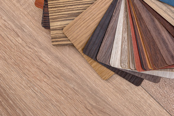 Obraz na płótnie Canvas Samples of color palette for furniture on wooden desk.