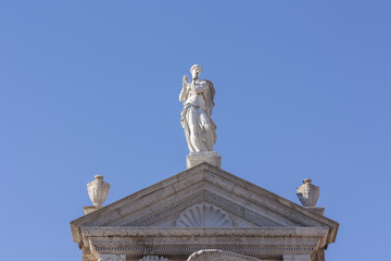 Just Statue present above the tympanum of the military arsenal of Venice