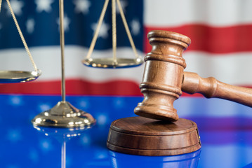 Law symbols on USA flag background.