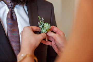 the bride wears a groom boutonniere