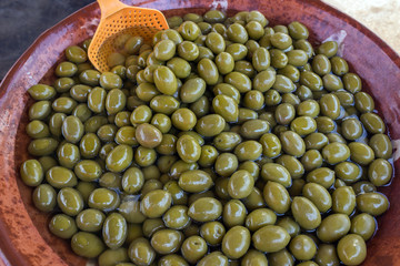 Green delicious marinated olives. Background. Texture. Greece.