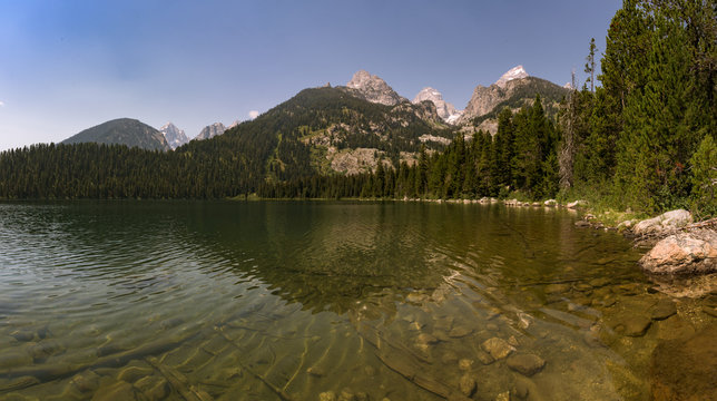 Ripples on Bradley Lake with Grand Teton National Park in the background.
