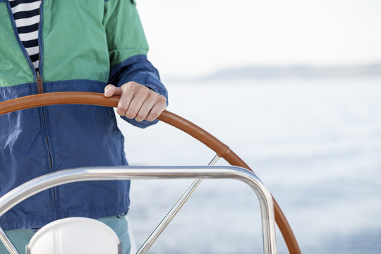 Man steering sailboat, Adriatic Sea