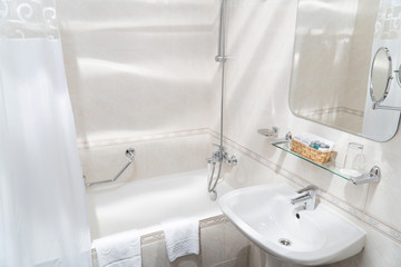 View of the cozy bright bathroom in the hotel