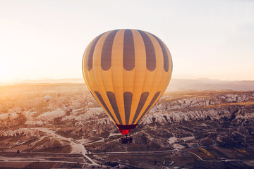Obraz premium The famous tourist attraction of Cappadocia is an air flight. Cappadocia is known all over the world as one of the best places for flights with balloons. Cappadocia, Turkey.