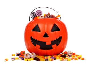 Black Halloween Jack o Lantern candy collector with scattered candy over a white background