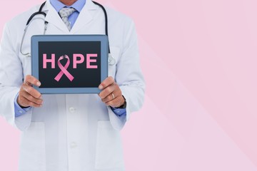 Doctor holding a tablet with a breast cancer awareness ribbon on