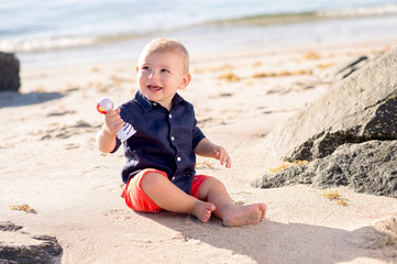 One Year Old Baby Boy Playing at the Beach
