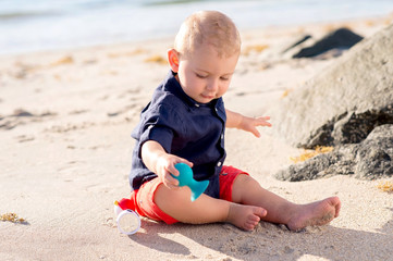 One Year Old Baby Boy Playing at the Beach