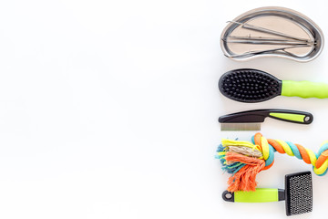 grooming set with pets cure tools on white background top view mockup