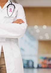 Doctor woman with breast cancer awareness ribbon
