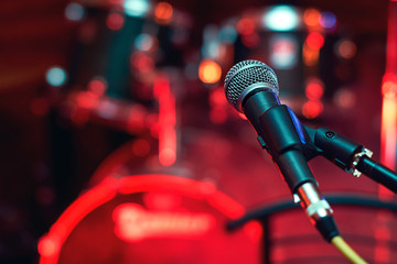 Microphone at concert on the stage with colorful light