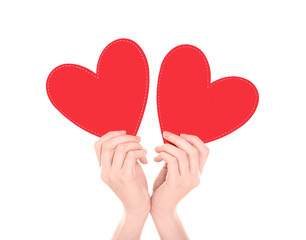 Woman holding red hearts on white background. Volunteer concept