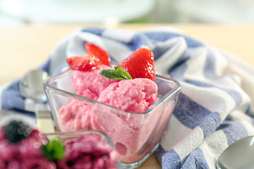 Bowl with tasty strawberry yogurt ice cream, closeup