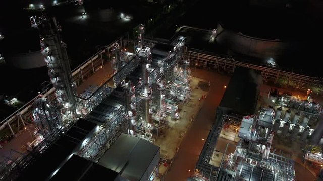 4K Night aerial view around oil refinery plant