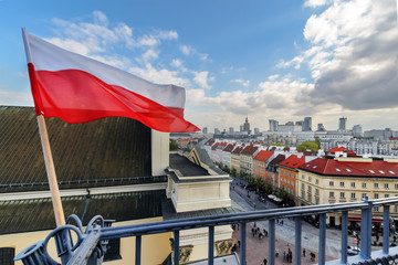 Poland Flag in Blue Sky and Warsaw in background - 170355250