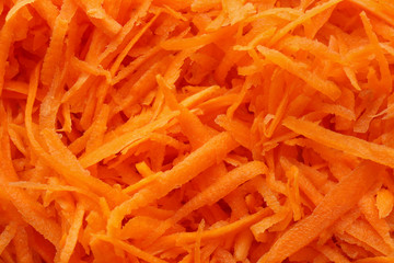 Fresh grated carrot, closeup
