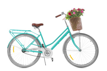 Fototapeta na wymiar Stylish bicycle with basket and flowers on white background