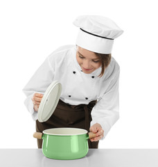 Female chef with saucepan on white background